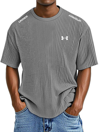 UNDER ARMOUR - Fritids-T-shirt med rund hals och präglat tryck