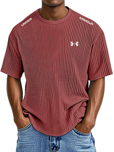 UNDER ARMOUR - Fritids-T-shirt med rund hals och präglat tryck