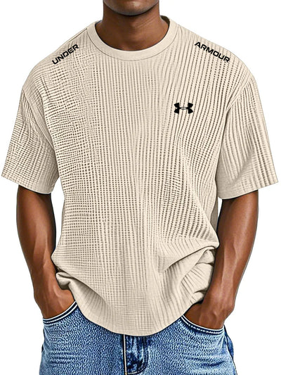 UNDER ARMOUR - Fritids-T-shirt med rund hals och präglat tryck