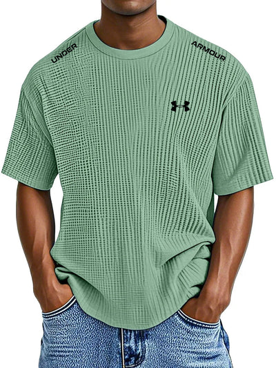 UNDER ARMOUR - Fritids-T-shirt med rund hals och präglat tryck