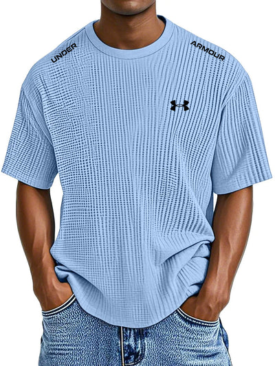 UNDER ARMOUR - Fritids-T-shirt med rund hals och präglat tryck