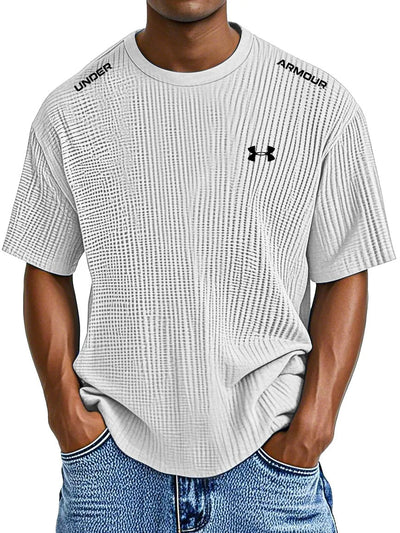 UNDER ARMOUR - Fritids-T-shirt med rund hals och präglat tryck