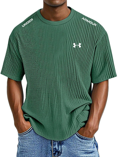 UNDER ARMOUR - Fritids-T-shirt med rund hals och präglat tryck