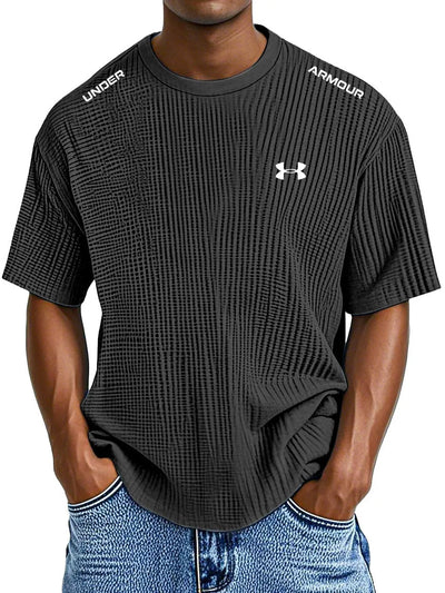 UNDER ARMOUR - Fritids-T-shirt med rund hals och präglat tryck